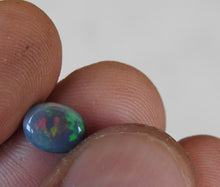 Load image into Gallery viewer, Natural Lightning Ridge Solid Black Opal with Red Green Colors.